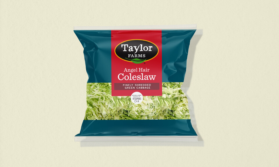 10 oz package of Taylor Farms Angel Hair Coleslaw, featuring fresh shredded cabbage and carrots for salads and sides.