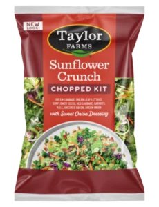 The Sunflower Crunch Chopped Salad Kit, with fresh green leaf, kale, sunflower seeds, and crumbled bacon tossed with a sweet onion coleslaw dressing.