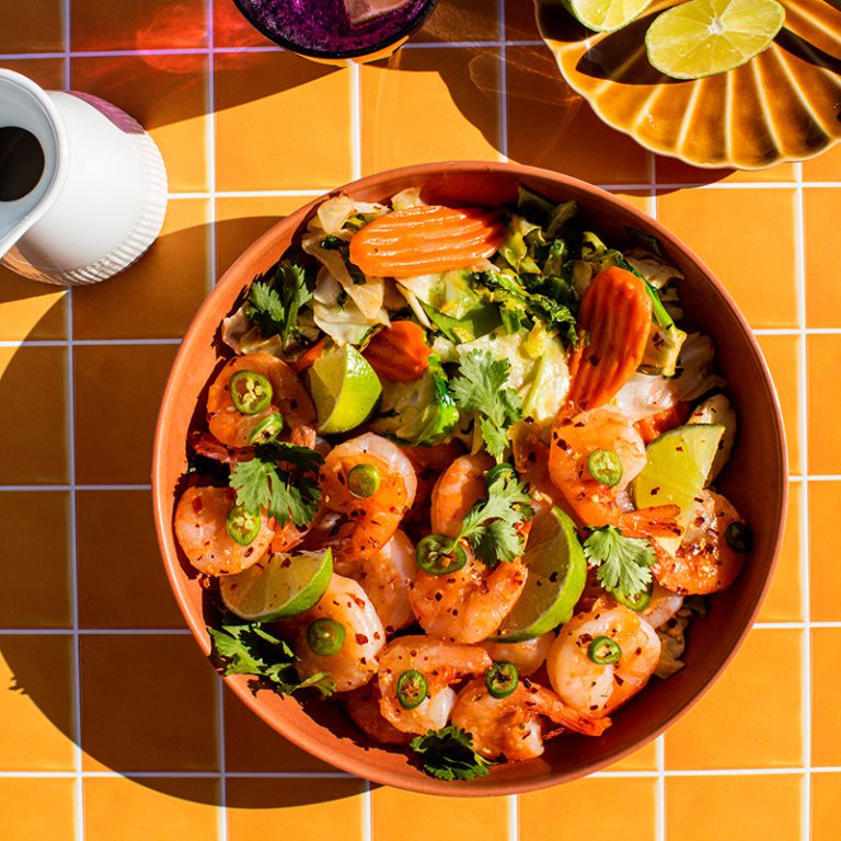 Pad Thai Kit with shrimp, fresh vegetables, and garnishes in a vibrant display, perfect for a quick and delicious meal.