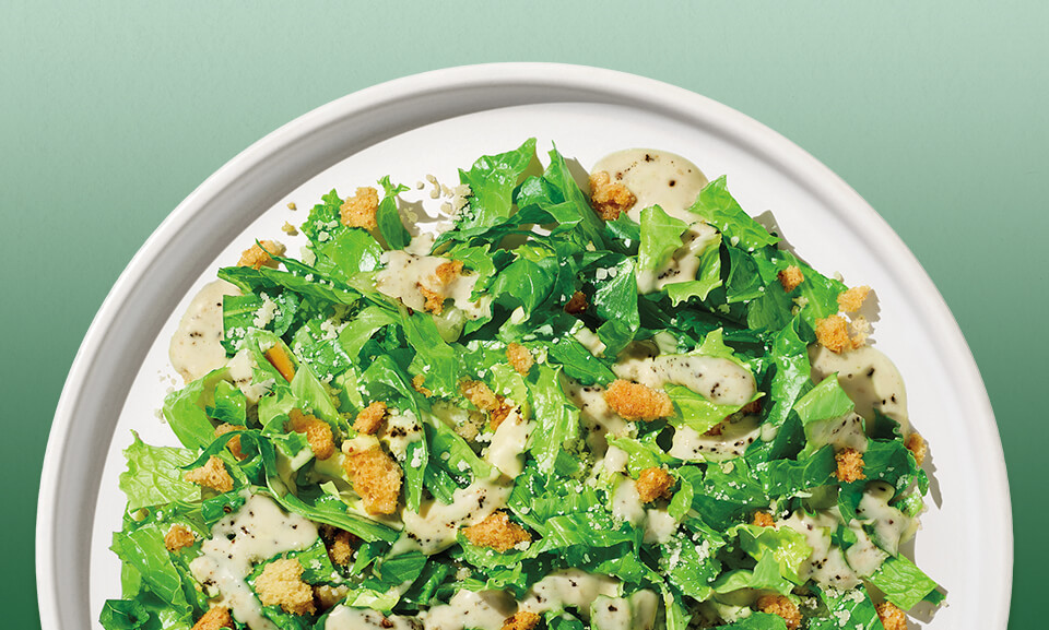 Fresh Caesar Mini Chopped Salad Kit with crisp romaine, parmesan cheese, and crunchy croutons, ideal for quick meals.