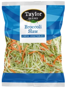 Fresh broccoli slaw mix with vibrant green shreds and colorful carrots, perfect for salads and healthy dishes.