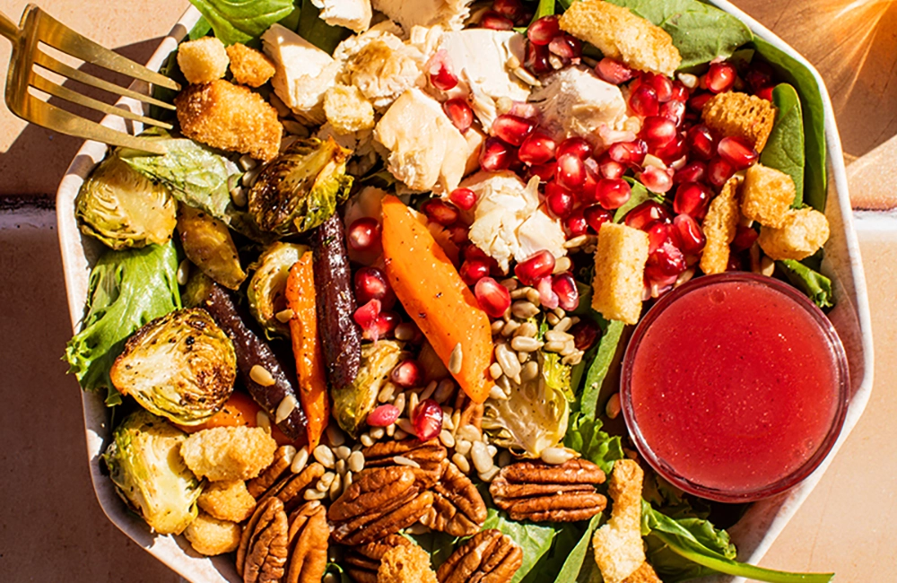 Thanksgiving leftover salad bowl featuring fresh vegetables and turkey, perfect for post-holiday meals.