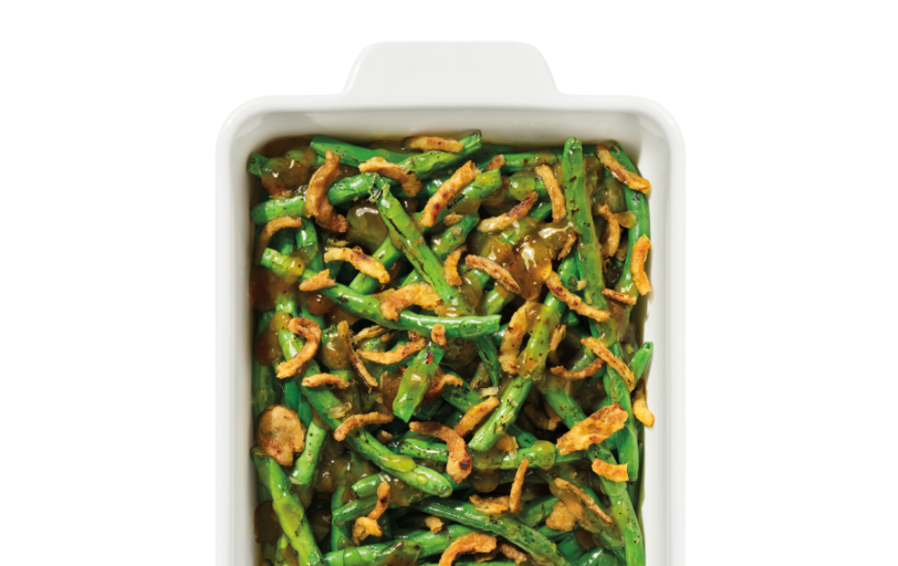 The Taylor Farms French Onion Green Beans Roast Kit package, showing whole green beans, French onion sauce, and crispy fried onions.