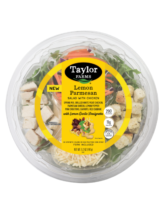 The Taylor Farms Lemon Parmesan Salad, a spring mix base with crisp carrots, red cabbage, parmesan shreds, and lemon pepper mini croutons.