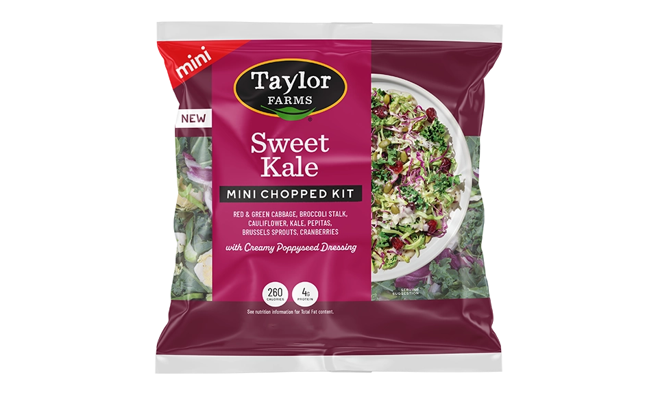 The Taylor Farms Sweet Kale Mini Chopped Salad Kit package, showing red & green cabbage, broccoli stalk, cauliflower, kale, pepitas, Brussels sprouts, cranberries, and poppyseed dressing.