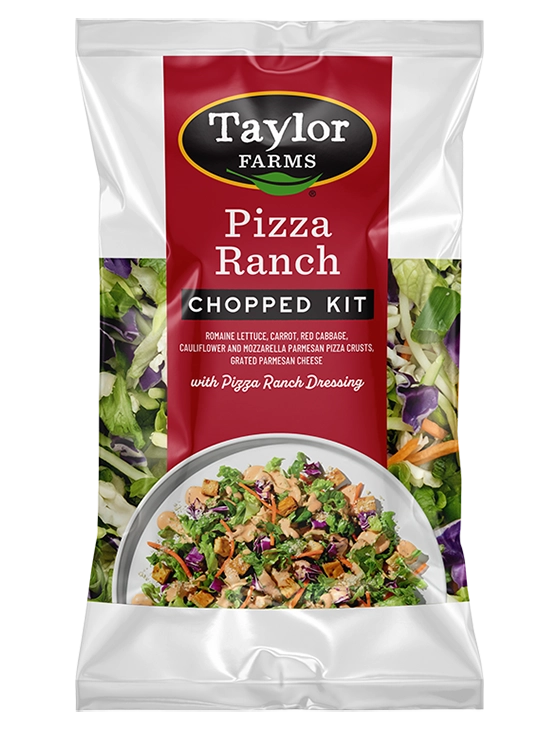 The Taylor Farms Pizza Ranch Chopped Kit package, showing chopped romaine lettuce, carrot, red cabbage, pizza crust pieces, grated parmesan cheese, and Pizza Ranch Dressing.