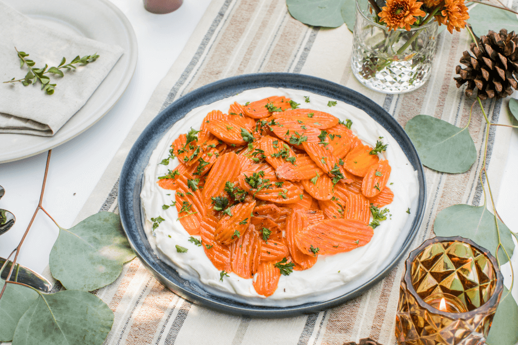 Brown sugar glazed carrots served on a bed of creamy whipped ricotta.