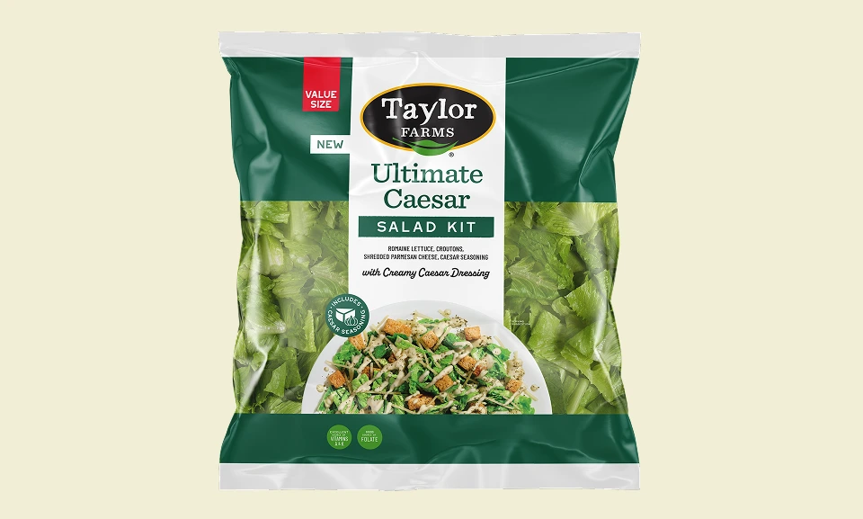 Ultimate Caesar Salad Kit from Taylor Farms featuring romaine lettuce, croutons, and zesty dressing.