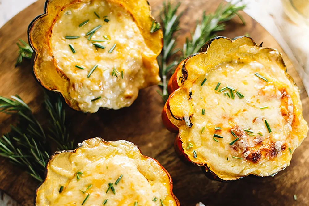 Cheesy baked cauliflower and acorn squash cups, a delicious and healthy side dish from Taylor Farms.