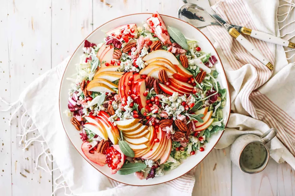 Fall Harvest Gorgonzola and Apple Salad featuring fresh greens, sliced apples, and crumbled gorgonzola cheese.