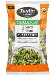The Honey Citrus Chopped Salad Kit package with green leaf lettuce, red & savoy cabbage, broccoli, carrot, green onion, dried cranberries, feta cheese crumbles, crisp quinoa with honey citrus vinaigrette.